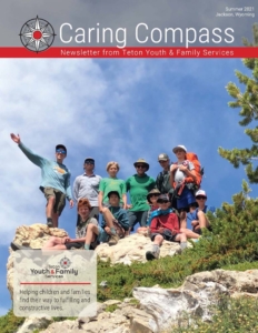 Summer 2021 newsletter cover_kids posing on a mountain top