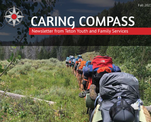 Cover of TYFS fall 2023 newsletter - kids backpacking