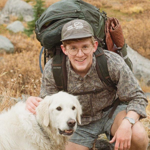 Ben Short with backpack and dog