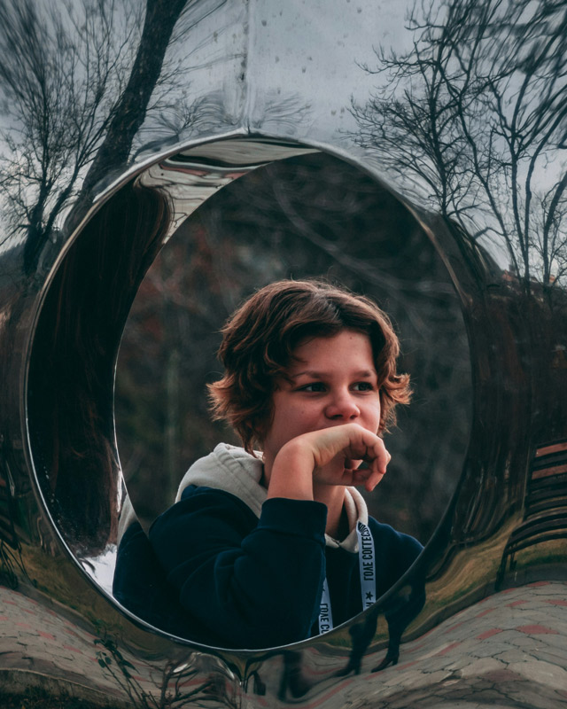 kid looking off camera - reflecting